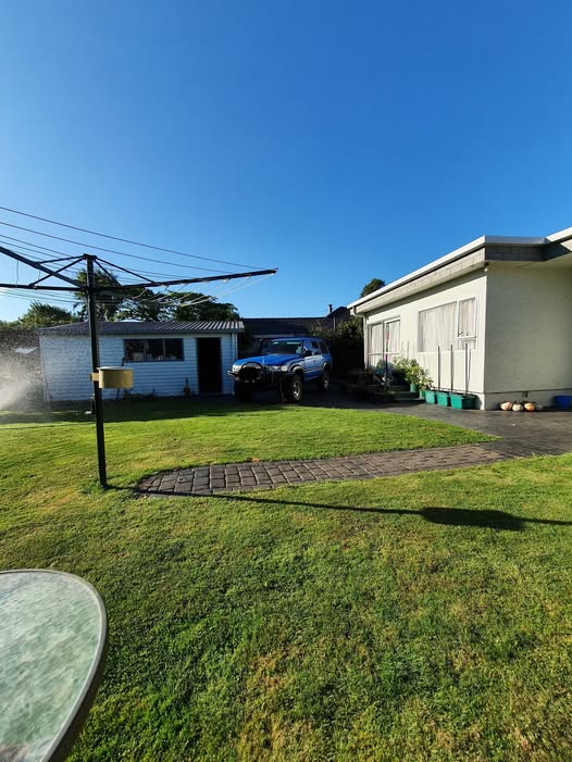 Freshly mowed lawn in front of a Christchurch home — a Blaze Mowing result